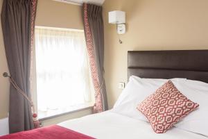 Voodi või voodid majutusasutuse The Draper Rooms toas