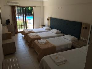 Postel nebo postele na pokoji v ubytování Hamle Hotel