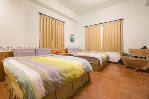 Katil atau katil-katil dalam bilik di Sen Yun Chuang Yuan Homestay NO1249