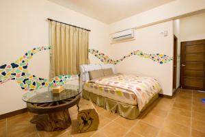 Katil atau katil-katil dalam bilik di Sen Yun Chuang Yuan Homestay NO1249
