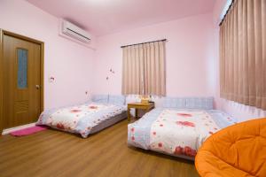 Katil atau katil-katil dalam bilik di Sen Yun Chuang Yuan Homestay NO1249