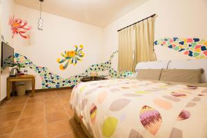 Katil atau katil-katil dalam bilik di Sen Yun Chuang Yuan Homestay NO1249