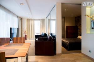 a living room with a couch and a table at Old Riga Modern Apartment in Riga