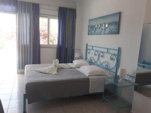 Cama o camas de una habitación en Mariliza Beach Hotel