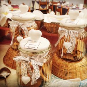 a group of glass jars with hearts in them at Hotel Savoia in Lido di Jesolo