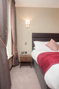 Voodi või voodid majutusasutuse The Draper Rooms toas
