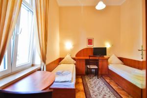 Postel nebo postele na pokoji v ubytování Villa Antares I & II