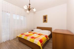 Posteľ alebo postele v izbe v ubytovaní Apartman Domić