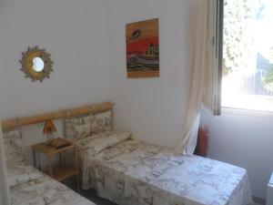 Postel nebo postele na pokoji v ubytování Attico a 150 mt dal mare