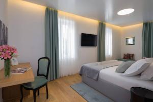 Кровать или кровати в номере Belvedere Luxury Rooms - Breathtaking View