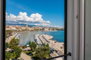 a view of a harbor from a window at Belvedere Luxury Rooms - Breathtaking View in Split
