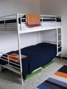 a bedroom with two bunk beds in a room at Villa CapCerbere in Cerbère