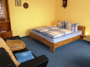 Ένα ή περισσότερα κρεβάτια σε δωμάτιο στο Ferienwohnung Raddatz