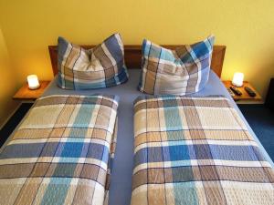 Ένα ή περισσότερα κρεβάτια σε δωμάτιο στο Ferienwohnung Raddatz +11 φωτογραφίες