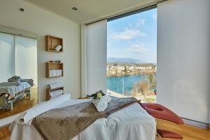 Rúm í herbergi á H4 Hotel Solothurn
