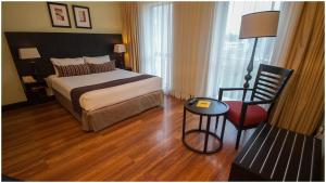 Кровать или кровати в номере Mount Meru Hotel