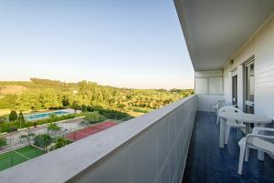 En balkong eller terrasse på Curia Clube