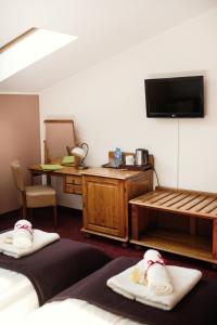 Łóżko lub łóżka w pokoju w obiekcie Hotel Eden