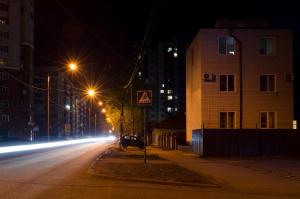 an empty city street at night with street lights at Guest House on Partizanskaya in Barnaul