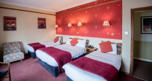 Postelja oz. postelje v sobi nastanitve Failte Hotel