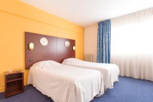 Posteľ alebo postele v izbe v ubytovaní Hôtel Les Gens De Mer Le Havre by Popinns