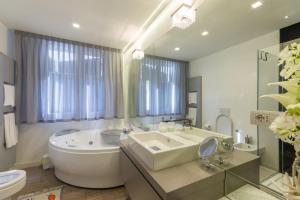 A bathroom at Cervia Marina Suite Még 37 kép