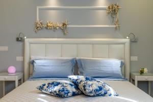 A bed or beds in a room at Cervia Marina Suite