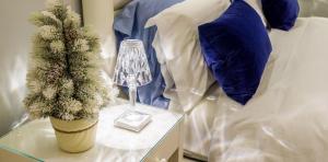 A bed or beds in a room at Cervia Marina Suite