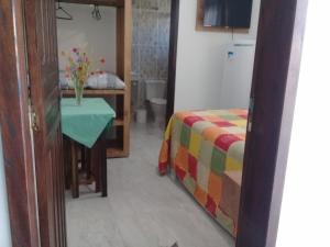 Postel nebo postele na pokoji v ubytování Pousada Maria Helena