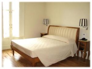 Postel nebo postele na pokoji v ubytování Hotel Certosa
