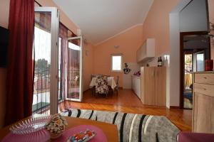 a living room with a couch and a table at Apartman Milošević in Kotor