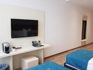 Postel nebo postele na pokoji v ubytování RheinCity Hotel & Boardinghouse