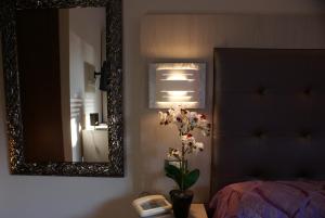 Postel nebo postele na pokoji v ubytování Hotel Michela