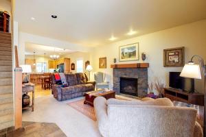 a living room with a couch and a fireplace at Linton Loop in Bend