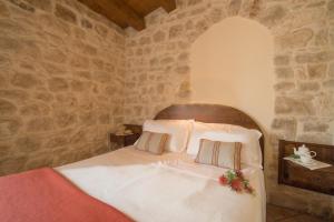 Letto o letti in una camera di Torre Don Virgilio Country Hotel