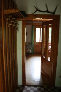 an open door to a room with a room with at Chata Čučka in Pribylina