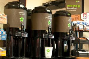 a group of bottles of coffee on a shelf at Extended Stay America Suites - Washington, DC - Chantilly - Dulles South in Chantilly