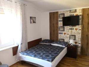 Postel nebo postele na pokoji v ubytování Pokoje wakacyjne - Wizygran