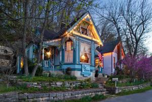 a house with christmas lights on the front of it at Cliff Cottage Inn in Eureka Springs