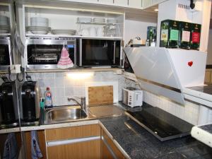 a kitchen with a sink and a counter top at Gästezimmer Jülich in Weil am Rhein