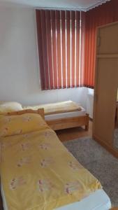 Posteľ alebo postele v izbe v ubytovaní Gina apartman Siófok