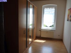 an empty room with a door and a window at Aleksandra & Daria in Erfurt