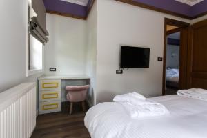 A bed or beds in a room at Abi Luxury Villas