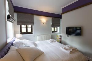 A bed or beds in a room at Abi Luxury Villas