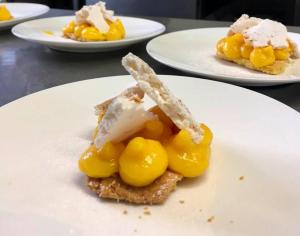 a piece of food on a plate on a table at Locanda Rocco da Francesco in Sirolo +9 photos