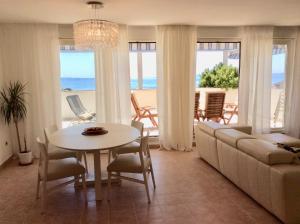 a living room with a couch and a table at Beach Apartment Lux View in Split
