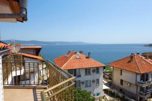a view of the ocean from a building at Gloria Holiday House in Nesebar