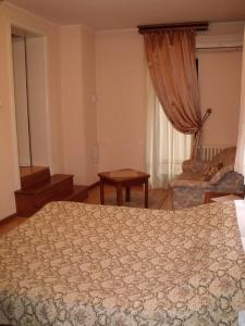 Rúm í herbergi á Garni Hotel PBG