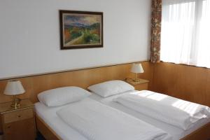 Letto o letti in una camera di Parkhotel Styria