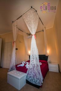 Postel nebo postele na pokoji v ubytování La Gioia di Sicilia B&B